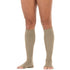 khaki knee-high socks worn by a person on a white background